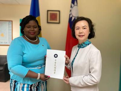Ambassador Fiona FAN presents the copy of credentials to SVG Foreign Minister Hon. Keisal Peters