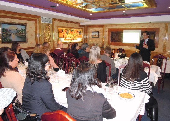 Ambassador Lee talking to the travel agents.