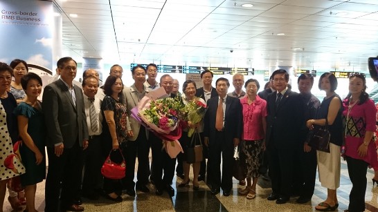 Representative Chang and Mrs. Chang (holding bouquets) arrived to a warm welcome from compatriots living and working in Singapore.