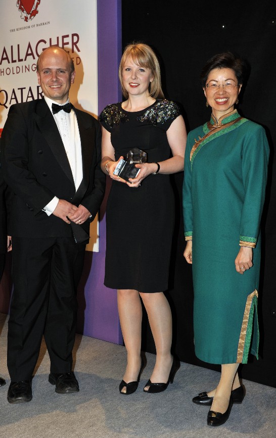 Justin Parkinson (second left) and Victoria King (second right) of the BBC Election 2010 Team, winners of the Web Innovation award, accept their award on stage, presented by Katherine Siao-Yue Chang Taipei Representative in the UK, during the Foreign Press Association in London Media Awards 2010 held at the Shearton Park Lane Hotel on Piccadilly, London.(Courtesy of FPA)