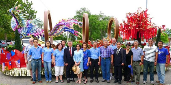 Volunteers of Utah’s Chinese Society in celebration of their winning of “2013 Mayor Award” at a float competition in Salt Lake City.