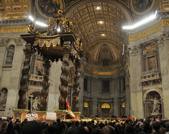 An overview of the inside of St. Peter’s Basilica crowed with people at Christmas Eve.