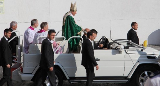 Pope Benedict XVI passes through the crowd gathered in St. Peter’s Square on board of his “Papamobile”