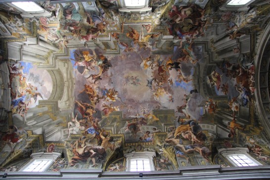 A view of the nave ceiling of the Church of St. Ignatius of Loyola which shows allegorical representations of the four continents known at that time: Asia, Africa, America, and Europe.