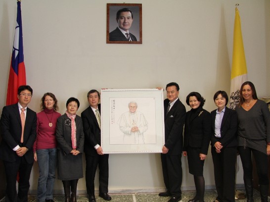 Ambassador and Mrs. Larry Wang (3rd and 4rt from right)with Prof. and Mrs. Shen Cheen (3rd and 4th from left) pose next to the paining in the company of some members of the Embassy staff.