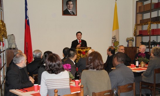 Ambassador Larry Wang addresses those presents during the Christmas gathering.
