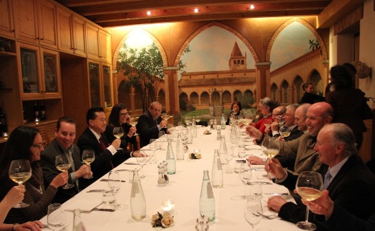 Ambassador Wand (3rd from left) and John Isacs (2nd from left) raise their glass to make a toast