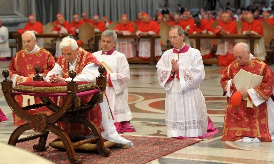The Holy Father genuflects to pray at the beginning of the Eucharistic Ceremony