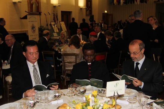 Ambassador Wang (1st from left) sits at the table next to Msgr. Fortunatus Nwachukwu (middle) and Prof. Giovanni Maria Vian (1st from right).