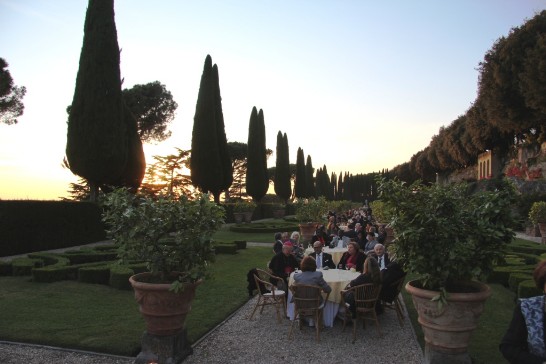The Diplomatic Corps to the Holy See enjoy the sunset with Vatican officials and Cardinal Bertone at the reception.