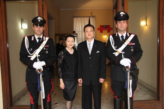 Ambassador and Mrs Wang pose with two Italian Carabinieri in charge of security during the National Day Reception.