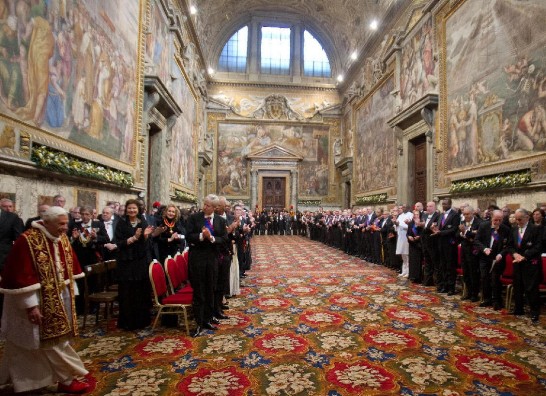 The members of the Diplomatic Corps accredited to the Holy See greet the Holy Father who enters the Regia Hall of the Apostolic Palace.