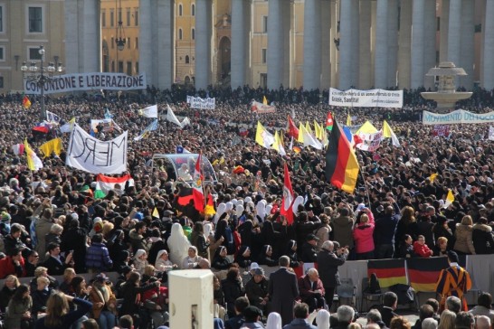 The Holy Father gives his final waves to cheering masses while going across the Square in his Popemobile.