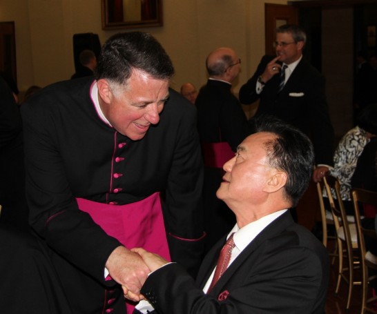 The Rector of the Pontifical North American College Rev. Msgr. James F. Checchio (1st from left) greets Ambassador Larry Wang (1st from right).