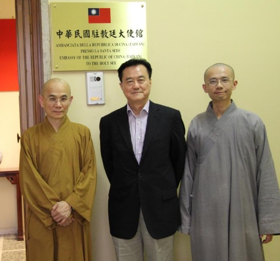 Ambassador Larry Yu-yuan Wang (middle) with Venerable Hui-min Shi (left) and Venerable Chang Shuan Shi (right) pose in front of the Chancery’s door.