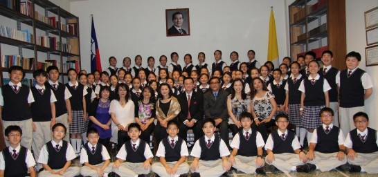 Ambassador and Mrs. Larry Wang (2nd row, 4th and 5th from right) pose with the members of the Choir inside the ROC Chancery.