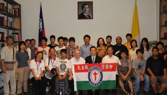 Group picture with Ambassador Larry Wang (middle, holding the flag), Fr. Felice Chech (to the left of Ambassador Wang), and the members of the delegation.