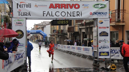 Taiwanese athlete Wang crosses the finishing line ranking third.