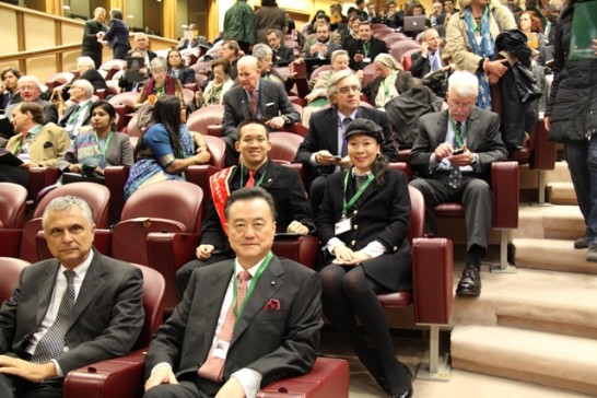 Ambassador Larry Wang (1st from right) listens to the speakers. Leland and his mother sit behind him.