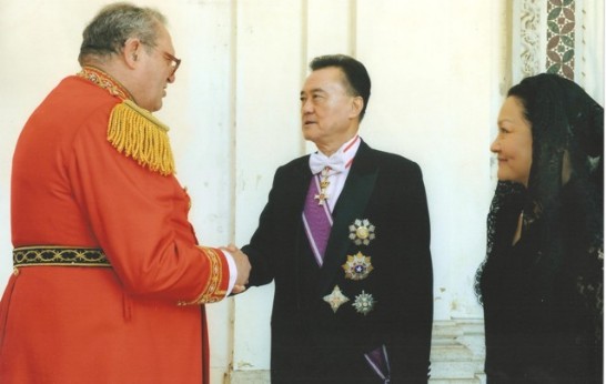 After the Mass, Ambassador Larry Wang (middle) accompanied by his consort (right) shakes hands with the Grand Master of the Order (left).