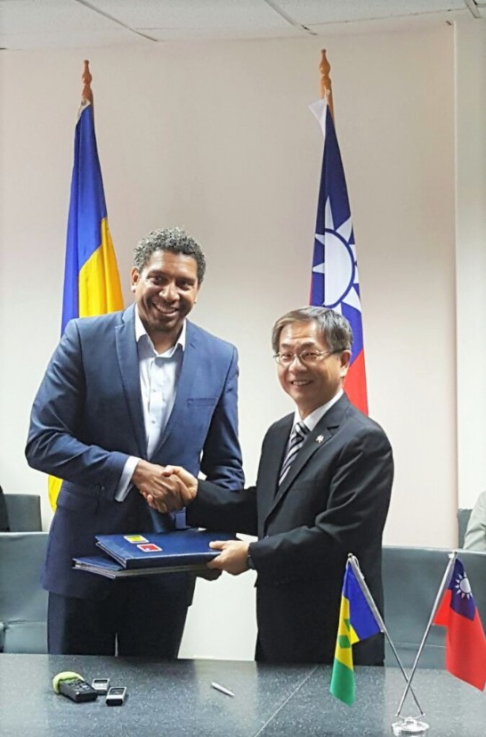 Amb. Ger and Minister Gonsalves exchange the signed ICT agreement