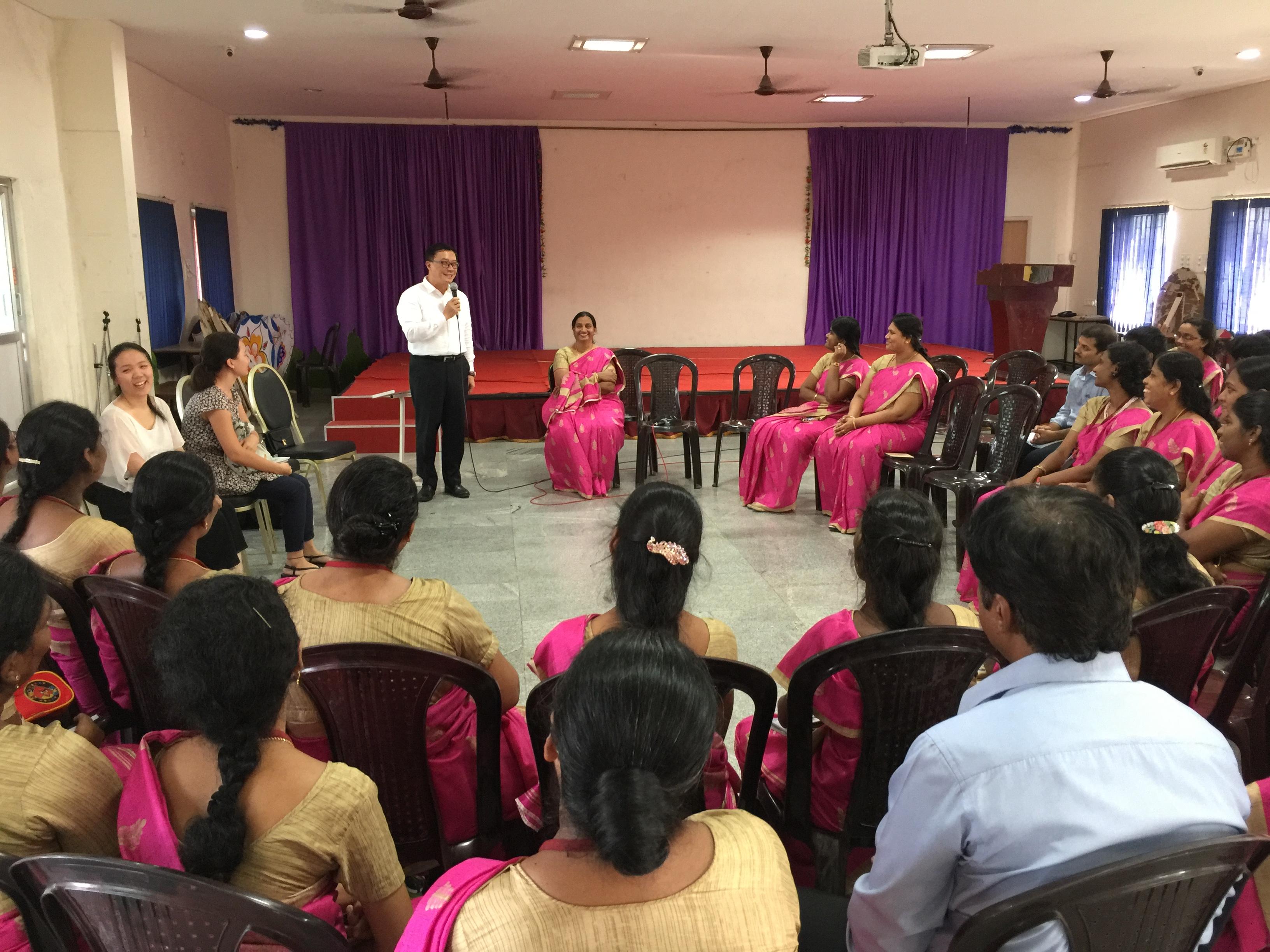 Director General Charles Li (standing)