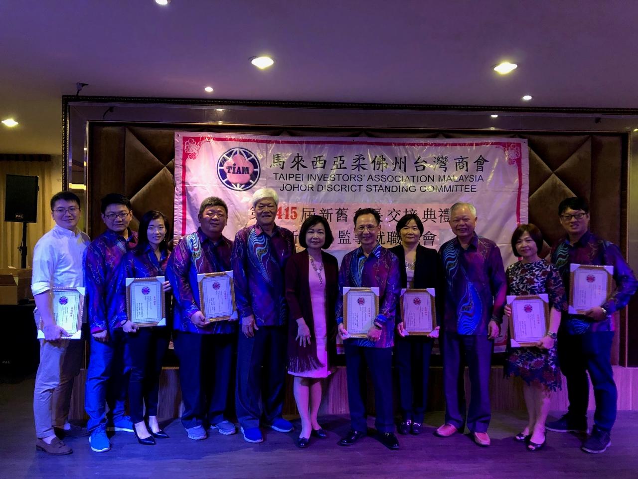 Representative Anne Hung (sixth from left) takes a photo with the new committee members.