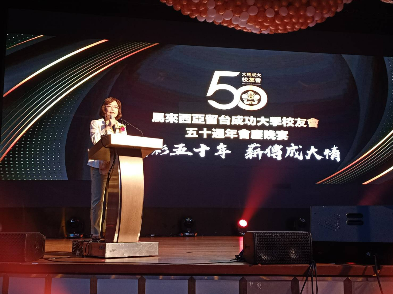 Representative Anne Hung delivers a speech.