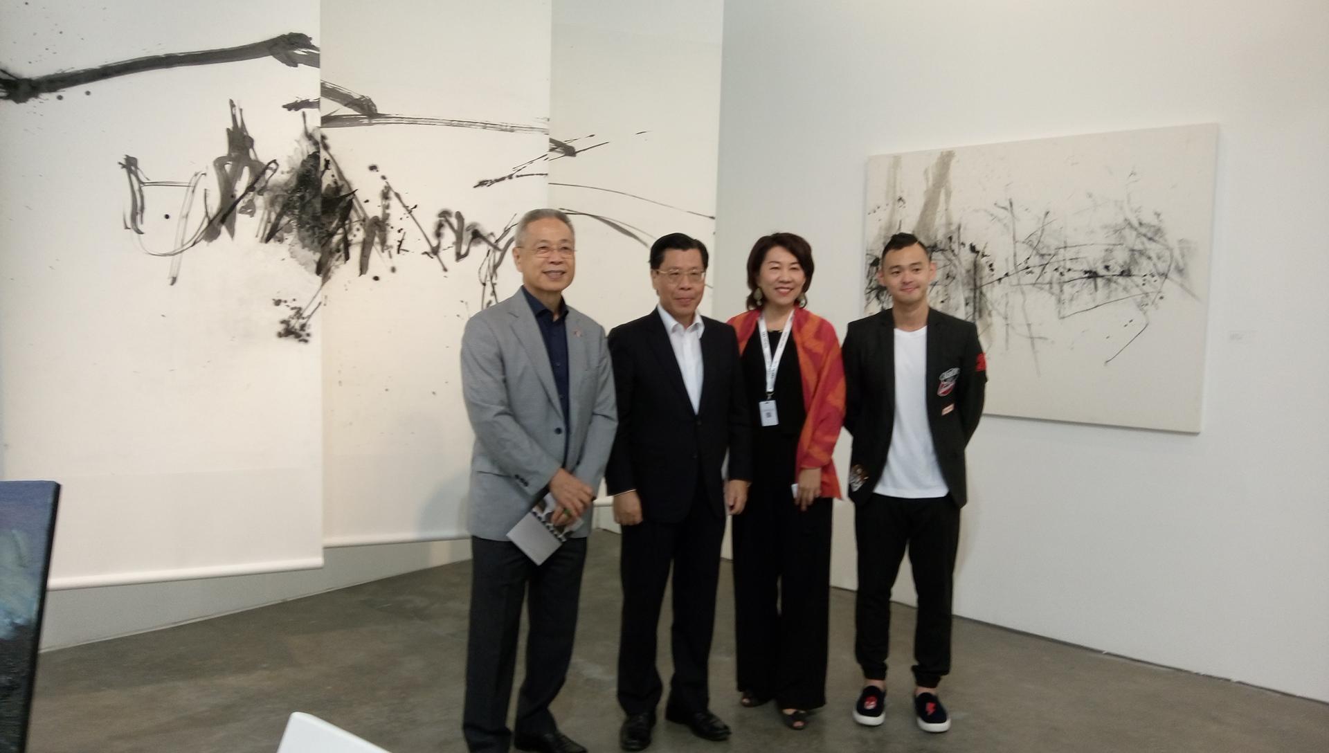 Representative Francis Liang (second from left) and guests being led on a tour of the exhibition by Mr. Marcus Teo, Chief Operating Officer, Art Stage Singapore 2018.
