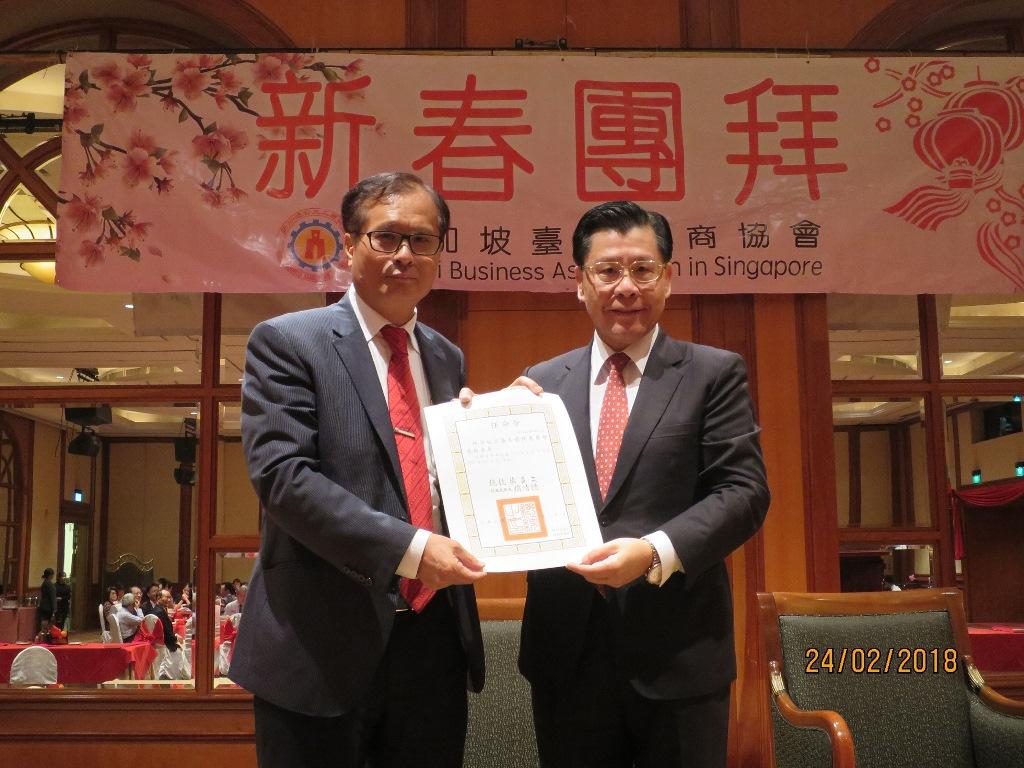 Representative Francis Liang (right) presenting Mr. Shih Chih Lung his official letter of appointment as commissioner of the Overseas Community Affairs Council.